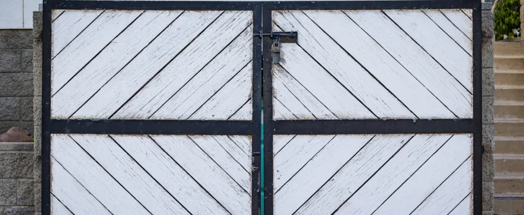 White double ranch-style gate on a driveway