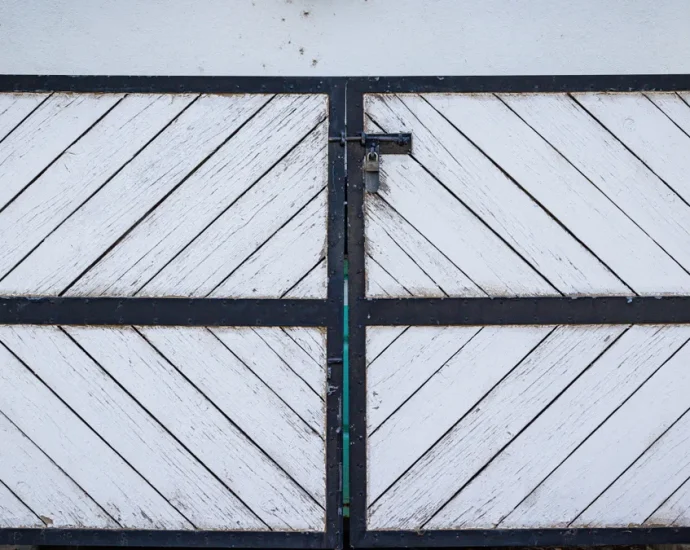 White double ranch-style gate on a driveway